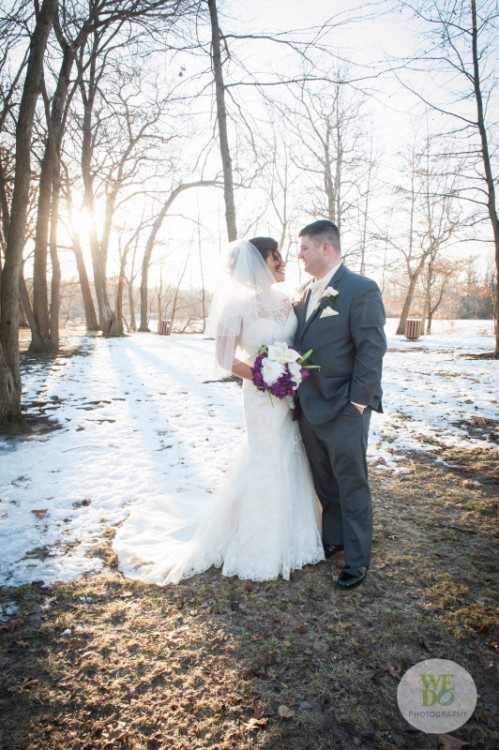 bride and groom in forest in winter