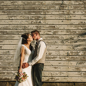 wedding photo with rustic backdrop