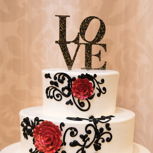 wedding cake with love topper