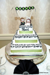 wedding cake with cartoon cake toppers