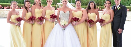 bridesmaids in yellow with red calla bouquets