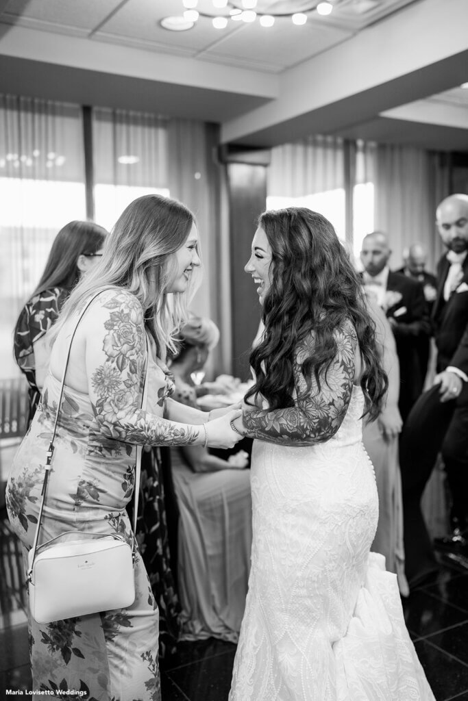 Bride greeting her guests during cocktail hour